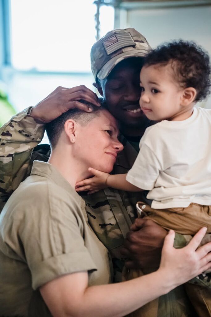 A Couple Hugging a Child